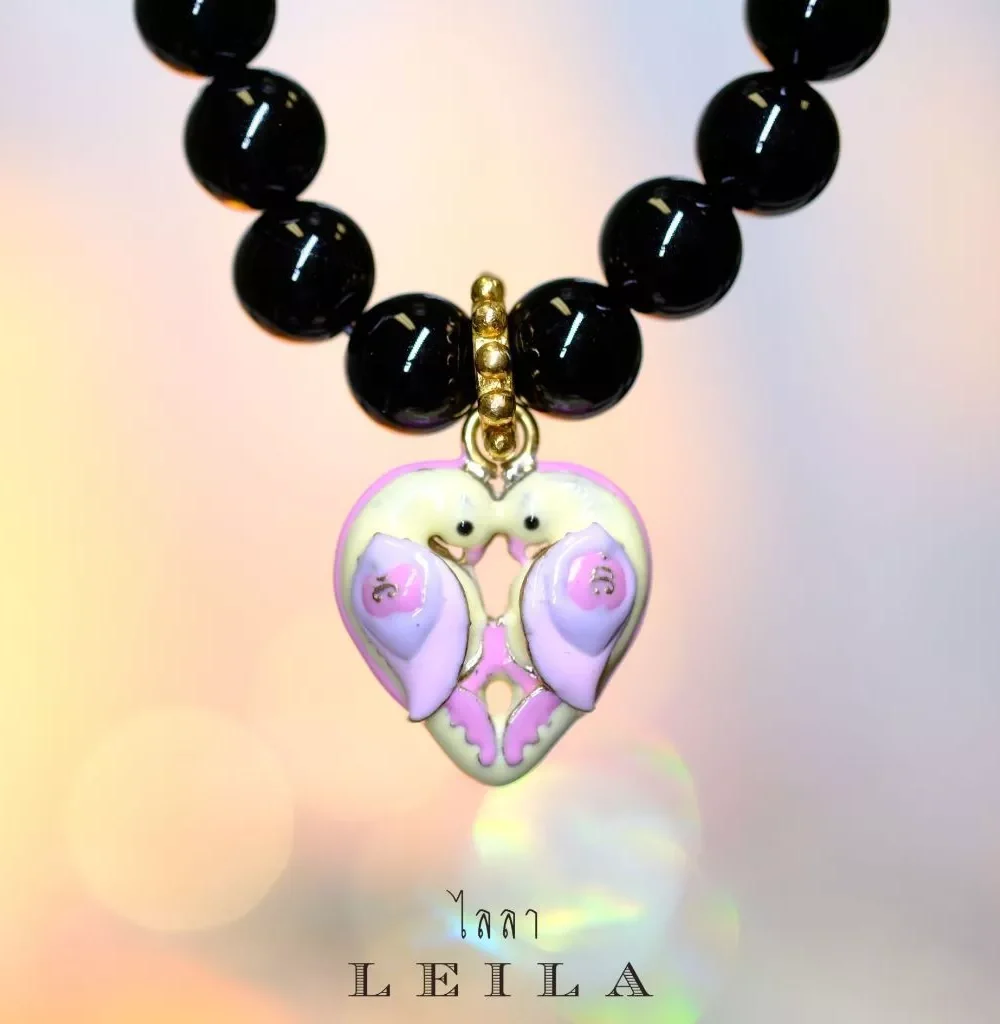 Leila Amulets, a pair of magpies